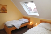 Schlafzimmer OG - RESERVIERT! Maritimes Wohnen am Siel – Maisonette in Greetsiel