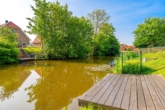 Steg am Wasser (optional) - Exklusives Ferienhaus am Wasser | Neubau nahe Greetsiel
